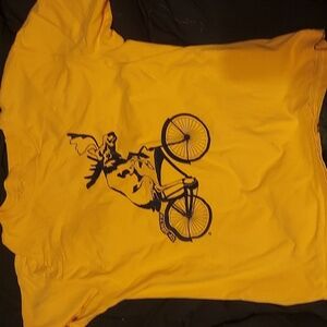 Bizarre graphic tee on yellow blank. Biking moose.